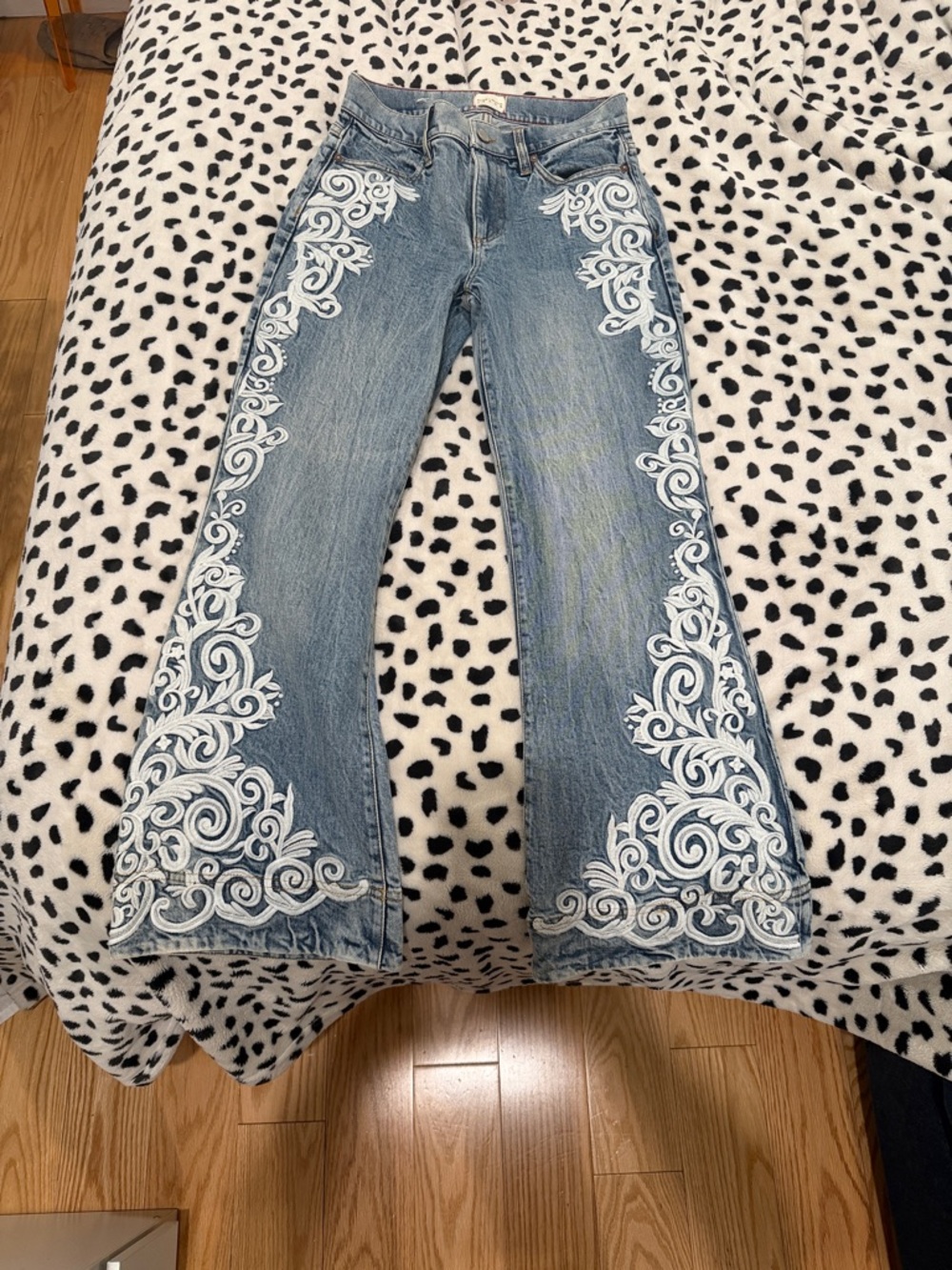 Alice + Olivia Light Blue Flared Jeans with White Embroidered Scrolls